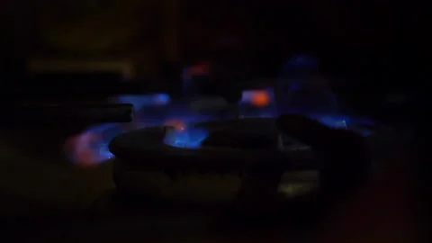 A close-up of a gas cooking ring being lit. Stock Footage 130475558