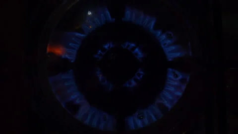 A close-up of a gas cooking ring being lit. Stock Footage 130476927