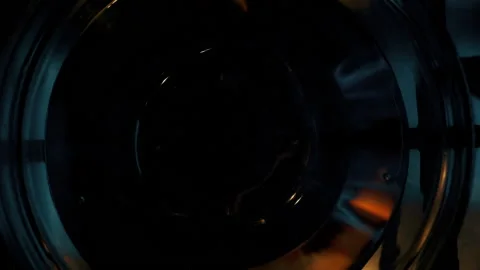 A close-up of a gas cooking ring being lit. Video stock 130479001