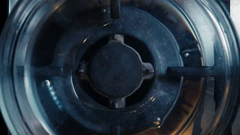 A close-up of a gas cooking ring being lit. Stock Footage 130479148