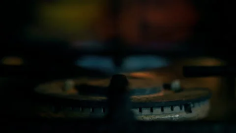 A close-up of a gas cooking ring being lit. Stock Footage 130479375