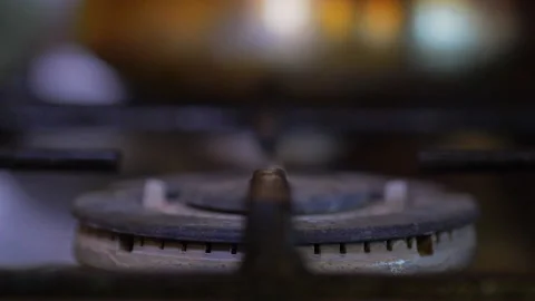A close-up of a gas cooking ring being lit. Stock Footage 130480239