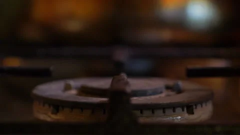 A close-up of a gas cooking ring being lit. Stock Footage 130481073
