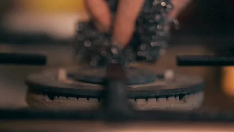 A close-up of a gas cooking ring being lit. Stock Footage 130482389
