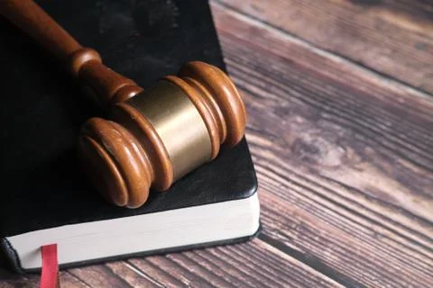 Close up of gavel on a book on table Stock Photos