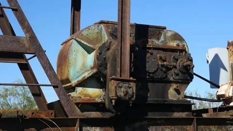 Close up of the gearbox on a pump jack oil rig Stock Footage