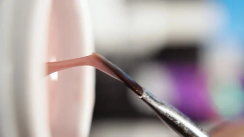 Close-Up of Gel Polish Being Loaded onto Nail Brush Stock Footage 314494530