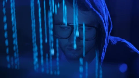 Close up of generation z hacker in glasses and hoodie working on computer. Stock Footage 95243776