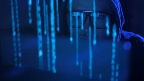 Close up of generation z hacker in glasses and hoodie working on computer. Stock Footage 95244089