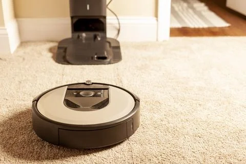Close up generic image for robot vacuum cleaner. This unit is operating on ca Stock Photos