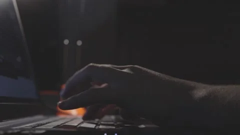 Close up of gentle hands pretending to type on computer keyboard buttons in dark Stock Footage 161038077