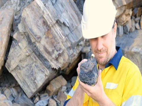 Close up of Geologist looking at coal sample mining mineral exploration  Stock Footage 78622774
