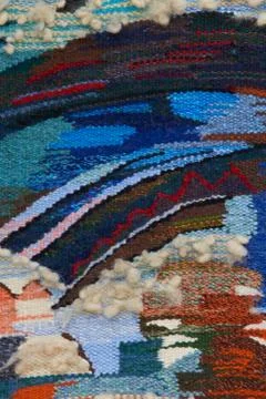 Close up of geometric patterned carpet. Hand woven rug with red Stock Photos