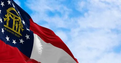 Close-up of Georgia state flag waving in the wind on a clear day Close-up ... 写真素材