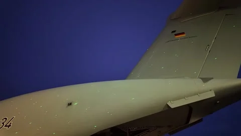 Close-up of German Luftwaffe Airbus A400M tail section at night during Malta Stock Footage 328339430