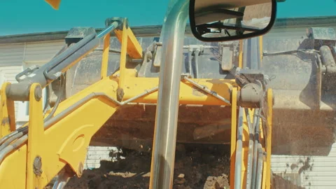 Close up Get a bird's-eye view of a bustling construction site as powerful Stock Footage 244490395