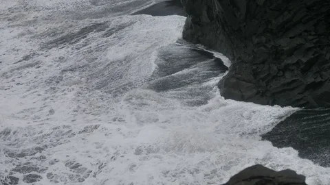 Close Up of Giant Waves Rolling and Crashing Agains The Dyrholaey Black Cliffs, Stock Footage 97391817