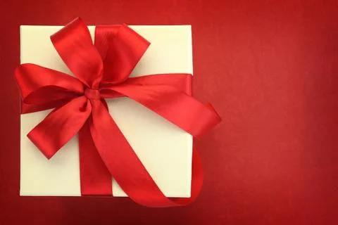 Close up of gift box on red background Stock Photos