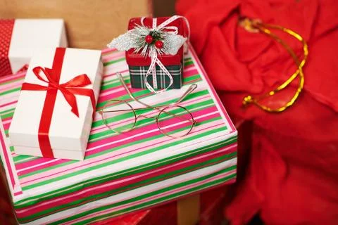 Close-up of gift boxes and red sack - Merry Christmas and Happy Holidays conc Stock Photos