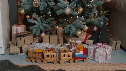Close up of a gift boxes and toys under the Christmas tree. Stock Footage 143100939