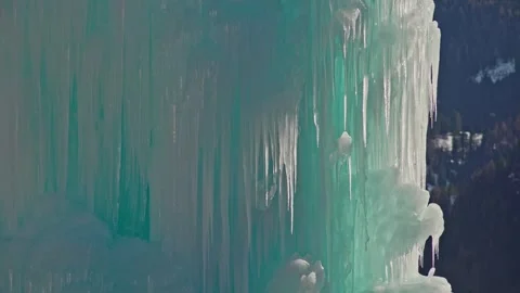 Close-up of a gigantic ice column with small dripping icicles Stock Footage 267053823