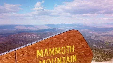 Close-up gimbal shot booming up of the elevation sign at the summit of Video stock 228428013