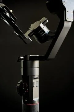 Close-up of gimbal stabilizer, with low-key lighting and a black background Photos