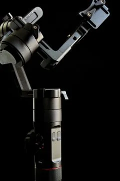 Close-up of gimbal stabilizer, with low-key lighting and a black background Photos