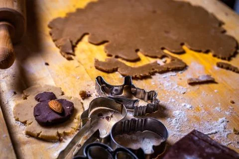 Close up on gingerbread dough and forms, cutters on the wooden table Stock Photos