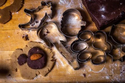 Close up on gingerbread dough and forms, cutters on the wooden table Stock Photos