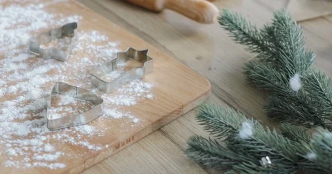 Close-up of gingerbread dough with flour and cookie cutter on table. making Stock Footage 81370531