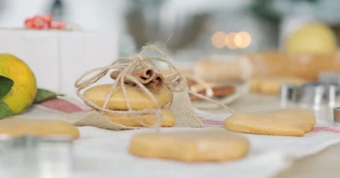 Close-up of gingerbread dough with flour and cookie cutter on table. Traditional Stock Footage 81370690