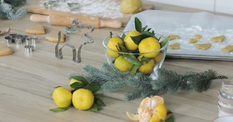 Close-up of gingerbread dough with flour and cookie cutter on table. Traditional Stock Footage 81371071
