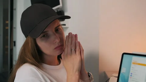 Close-up of a girl in a cap experiencing different emotions. Stock Footage 252456081