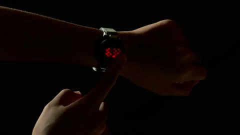 Close Up of A Girl Checking Time on Smart Watch Light In Dark Condition Stock Footage 234093456