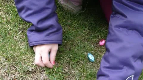 Close Up of Girl Collecting Easter Eggs Stock Footage 10880099