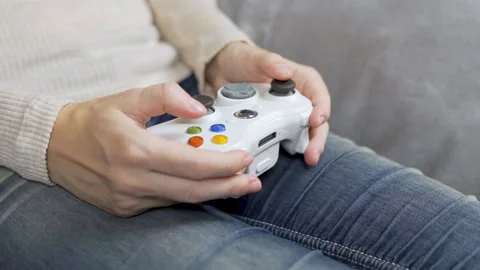 Close-up of a Girl Computer Gamer Using a Gamepad for Computer Games. Girl's Fin Stock Footage 141437708