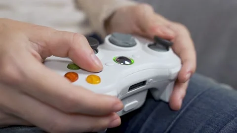Close-up of a Girl Computer Gamer Using a Gamepad for Computer Games. Girl's Fin Stock Footage 141437884