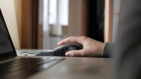 Close-up of a girl with dirty nails using a computer mouse. Stock Footage 105399656