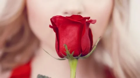 Close-up of girl face with red lips and red rose.  Stock-Footage 87870165