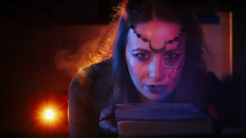 Close-up of a girl in the form of a witch looking at the camera. Stock Footage 285769811