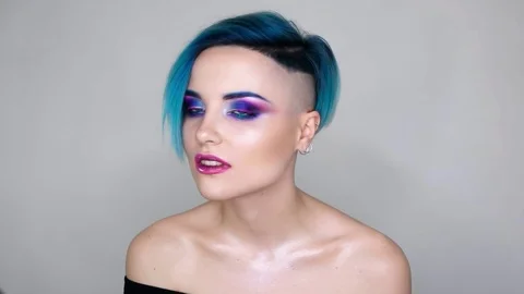 Close up of a girl with makeup posing for camera and smiling. Beauty blog Stock Footage 80759646