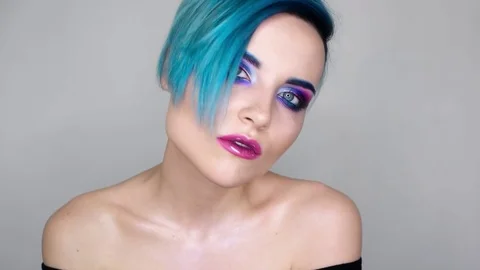 Close up of a girl with makeup posing for camera and smiling. Beauty blog Stock Footage 80759659