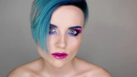 Close up of a girl with makeup posing for camera and smiling. Beauty blog Stock Footage 80759704