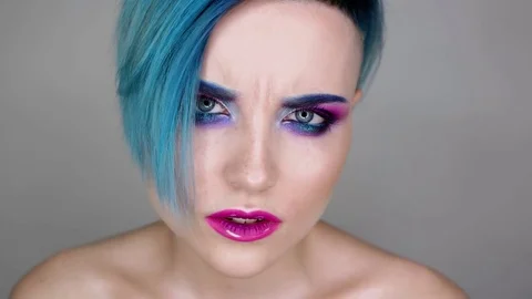 Close up of a girl with makeup posing for camera and smiling. Beauty blog Stock Footage 80759714