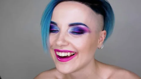 Close up of a girl with makeup posing for camera and smiling. Beauty blog Stock Footage 80759723