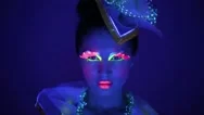 Close-Up Of A Girl With Neon Face Stock Footage