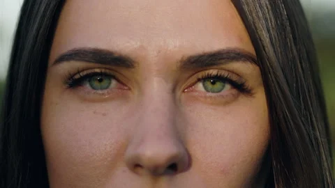 Close up girl opens her eyes. Sunlight flickers. Her pupils constrict. Gorgeous Stock Footage 277702166