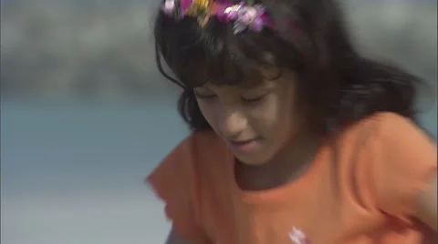Close up of a girl playing on a beach. Video stock 46863702