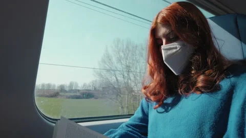 Close up of girl reading book on train Stock Footage 172070022